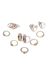 Close-up shot of twelve golden rings with gemstones and clear crystals. The elegant jewelry set is isolated on the white background. 