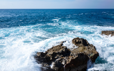 Waves crash on the rocky shore of the Mediterranean Sea on the Akamas Peninsula in the northwest of the island of Cyprus.