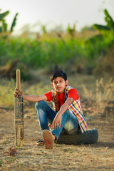 Rural Indian Child Playing Cricket