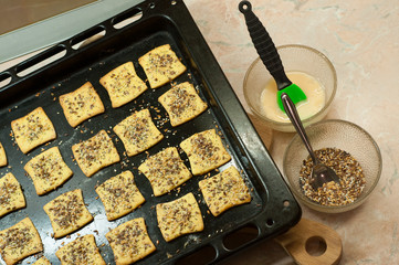 Making gluten free maize and rice flour cookies  with poppy seeds, sesame and flaxseed