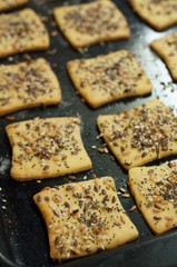 Making gluten free maize and rice flour cookies with poppy seeds, sesame and flaxseed