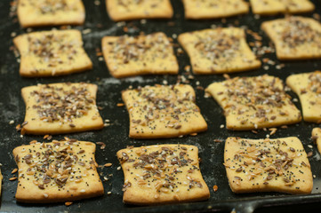 Making gluten free maize and rice flour cookies  with poppy seeds, sesame and flaxseed