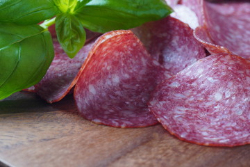 Sliced salami on cutting board
