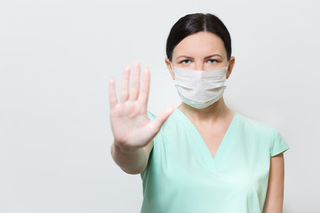 Portrait young European woman in protective disposable medical mask. concept of coronavirus influenza covid-19 quarantine and people panic.woman wearing blue medical protective mask to health protecti