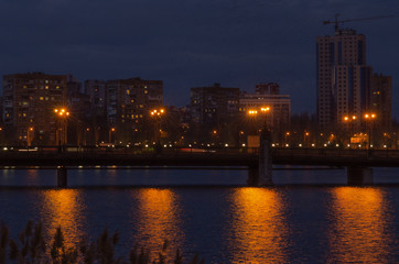 bridge on the embankment in the evening