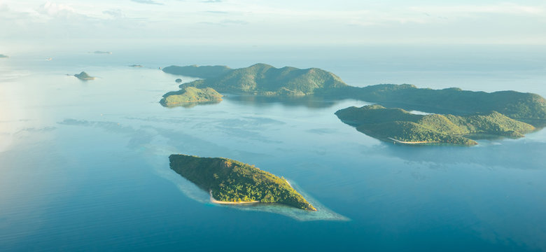 Aerial view over beautiful Philippine islands and deserted beaches.