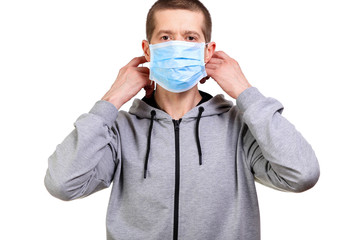 Sports man in hooded dress medical mask on face isolated