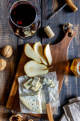Cheese platter with blue cheese and pear. Wine snack. Italian cuisine. Vegetarian food. Healthy eating.