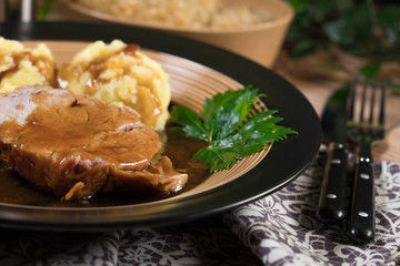 Braised pork neck in own sauce. Shallow depth of field.