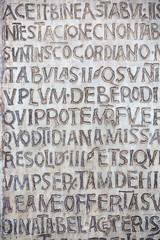 Latin written engraved on the stone
