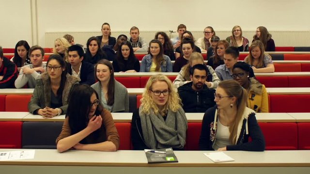 Timelapse of College Students filling up a University Lecture Hall or Classroom seats. Stock Video Clip Footage