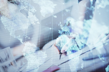 International business hologram over hands taking notes background. Concept of success. Multi exposure