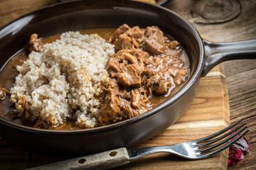Barley groats with stewed meat.