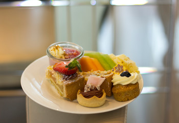 Dessert cakes on a white plate. Sweets.