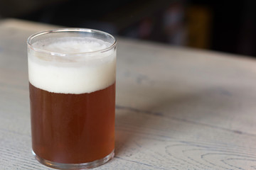 Fresh glass of delicious beer