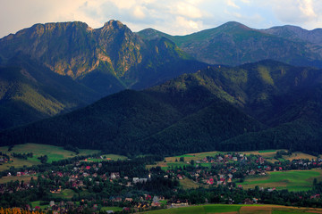 Fototapeta na wymiar Panoramic view of Tatra Mountains seen from Zakopane in Poland with Giewont, Czerwone Wierchy and Nosal peaks in background