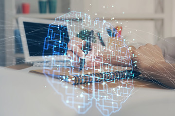 Multi exposure of writing hand on background with brain hologram. Concept of self learning.