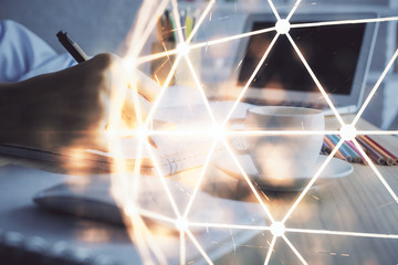 Social network theme hologram over woman's hands writing background. Concept of international people connect. Double exposure