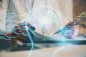 Multi exposure of writing hand on background with brain hologram. Concept of self learning.