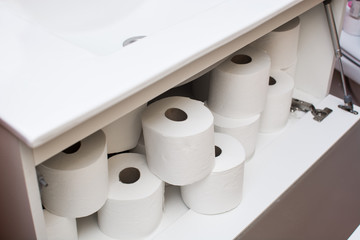 Fototapeta premium Paper rolls in bathroom furniture