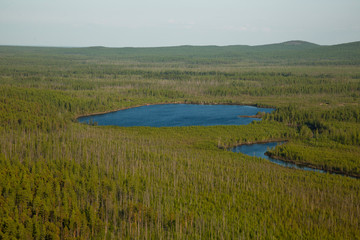 round lake in the Siberian taiga