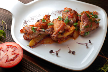 Chicken with potatoes, tomatoes, sweet onions and cilantro, chihirtma chicken