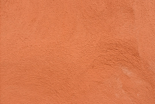 Mur crépi brossé rouge rouille