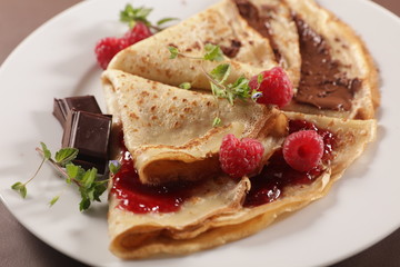 gourmet crepe with chocolate and raspberry jam