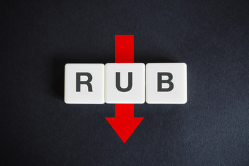 Russian ruble or rouble alphabetic currency ISO code (RUB) and down red arrow on black background....
