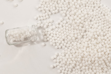 Homeopathy granules medicine isolated on a White Background
