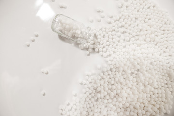 Homeopathy granules medicine isolated on a White Background