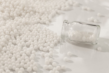 Homeopathy granules medicine isolated on a White Background