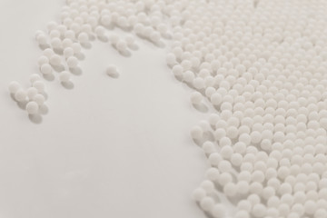 Fototapeta na wymiar Homeopathy granules medicine isolated on a White Background