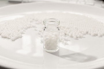 Homeopathy granules medicine isolated on a White Background