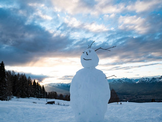 Happy snowman with amazing Dolomites mountains background
