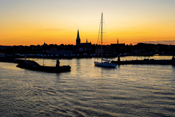 Silhouette of Helsingor harbour in sunset sky, Denmark
