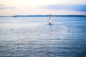 Fototapeta premium Sailing boats on a background of a beautiful sunset