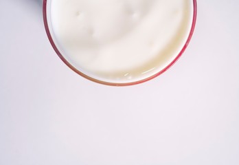 Nutritious and diet vegan dairy product in a glass cup. Glass with a milk drink in isolation on a white background