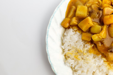 Curry and rice on white background