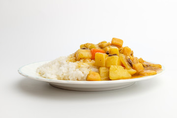 Curry and rice on white background
