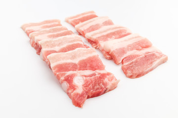 Sliced ​​pork belly on white background