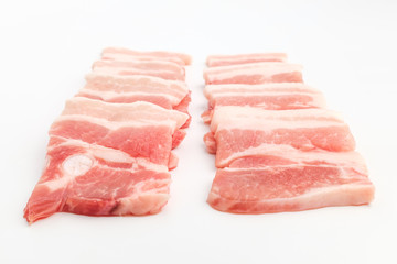 Sliced ​​pork belly on white background