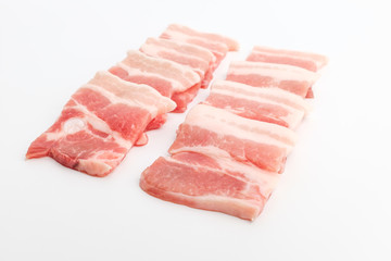 Sliced ​​pork belly on white background