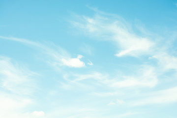 The movement of clouds on a blue sky.