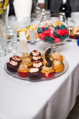 Multicolored pancakes and other sweets on the table. Candy bar