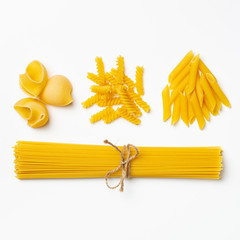 Raw italian spaghetti and pasta on a white background