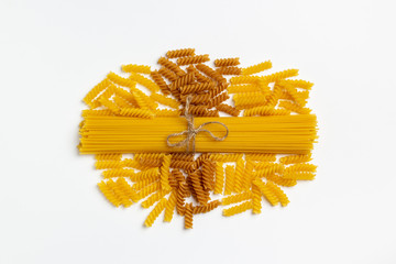Raw italian spaghetti and pasta on a white background