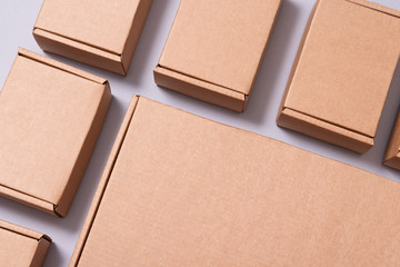 Lot of cardboard boxes on grey background, copy space