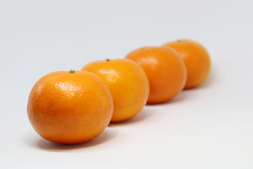 A group of Mandarin oranges isolated on white background
