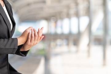 woman washing hands with alcohol gel after touching any surface in public avoid infections corona virus or COVID-19